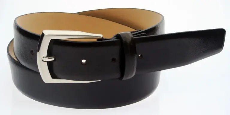 Close-up of a black leather belt with a silver buckle on a white background