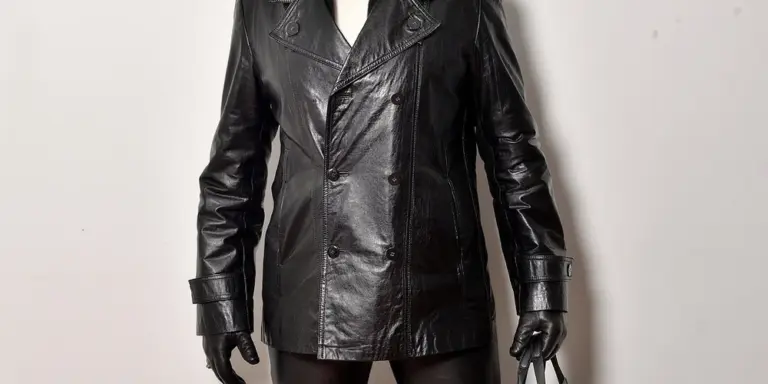 Front view of a person wearing a black leather jacket and black gloves
