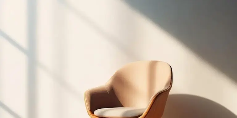 Beige leather chair bathed in natural light, showing a worn, faded surface suitable for color restoration.
