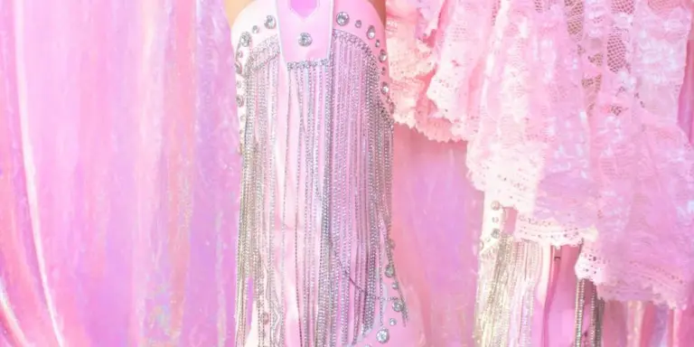 Close-up of pink fabric with fringe trim