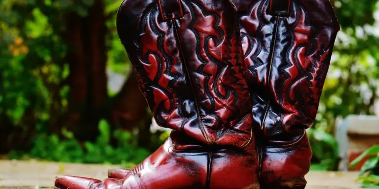 Red leather boots resting outdoors