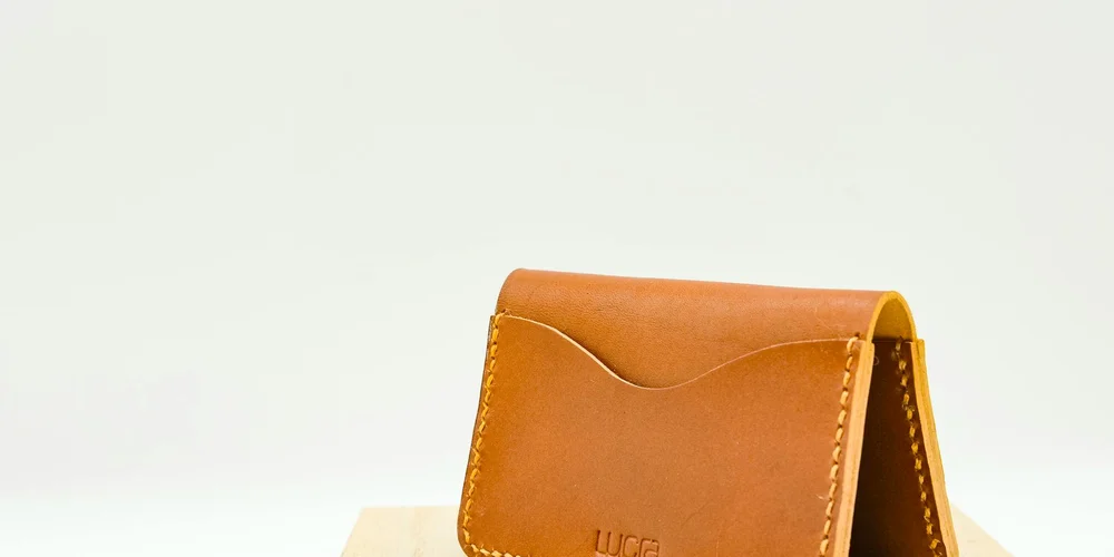 Brown leather cardholder on a white background