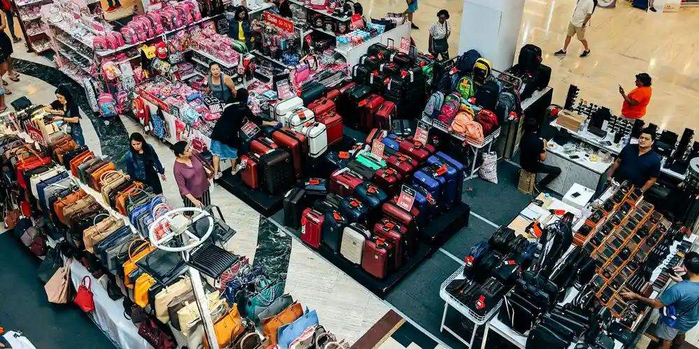 Rows of suitcases and bags on display in a retail store