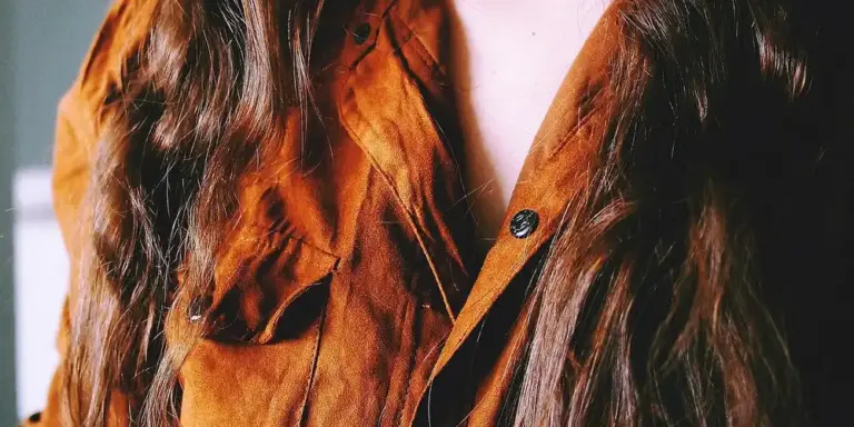 Close-up of brown suede material with visible texture.