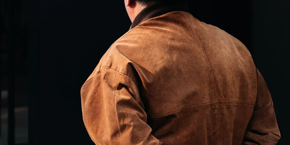 Back view of a brown suede jacket